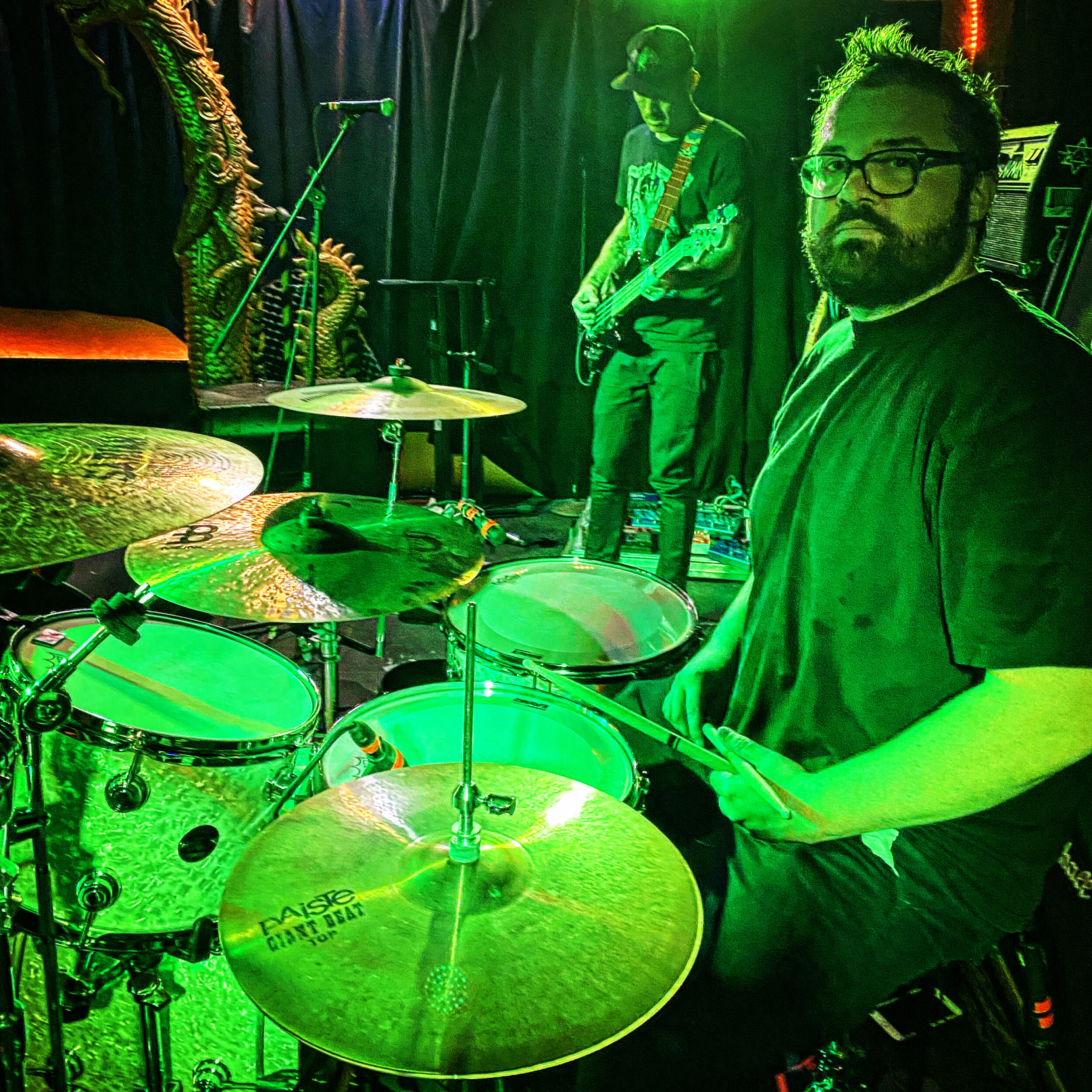 Brad Gardner on stage behind the drum kit